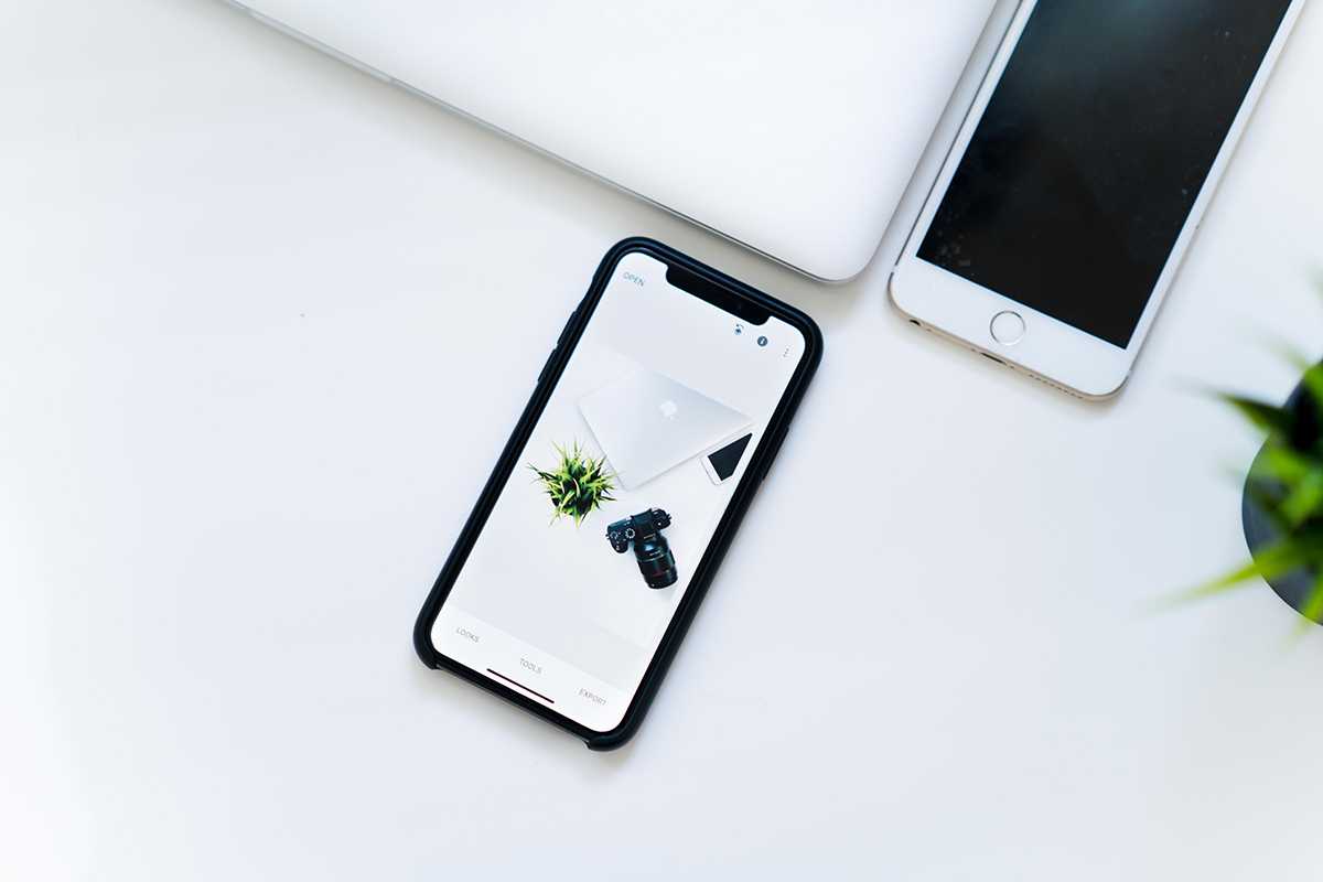 Image of phones on top of white desk